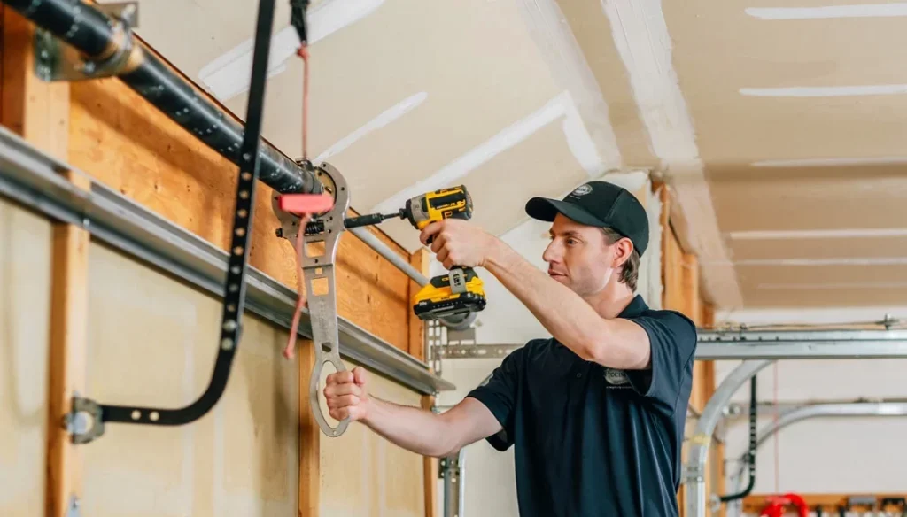 Technician inspecting a residential garage door