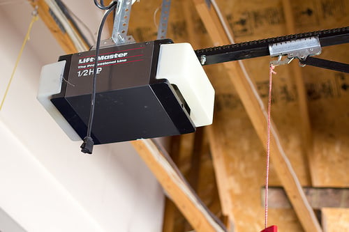 Broken torsion spring above a residential garage door